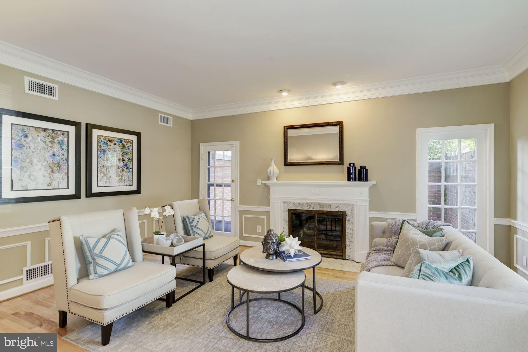 4200 River Road Northwest Washington, DC 20016 - Photo 4 of 30 a living room with furniture and a fireplace