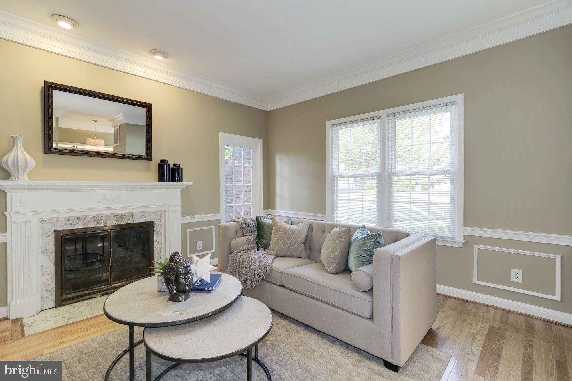 4200 River Road Northwest Washington, DC 20016 - Photo 5 of 30 a living room with furniture and a fireplace