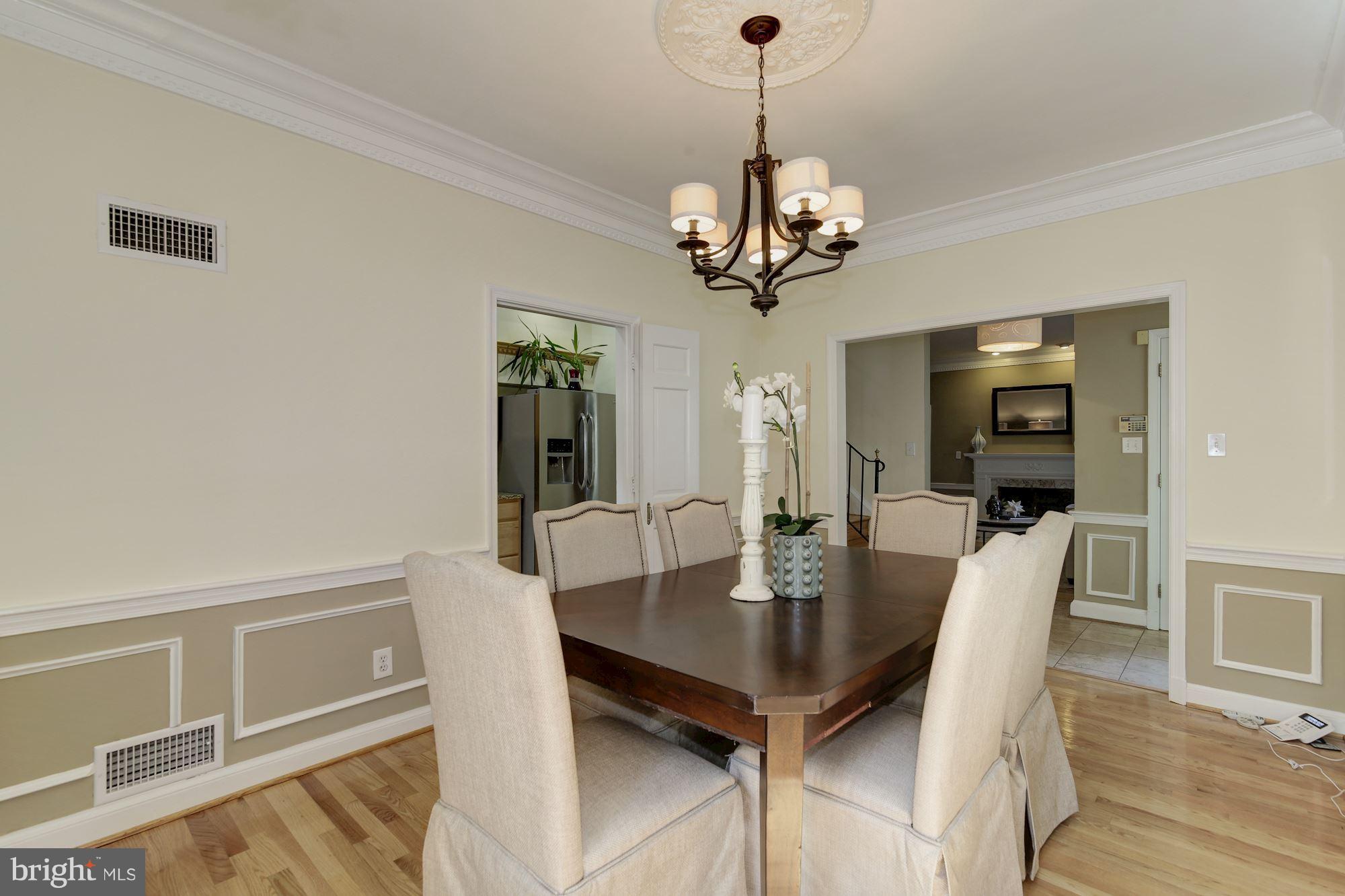 4200 River Road Northwest Washington, DC 20016 - Photo 7 of 30 a view of a dining room with furniture wooden floor and chandelier