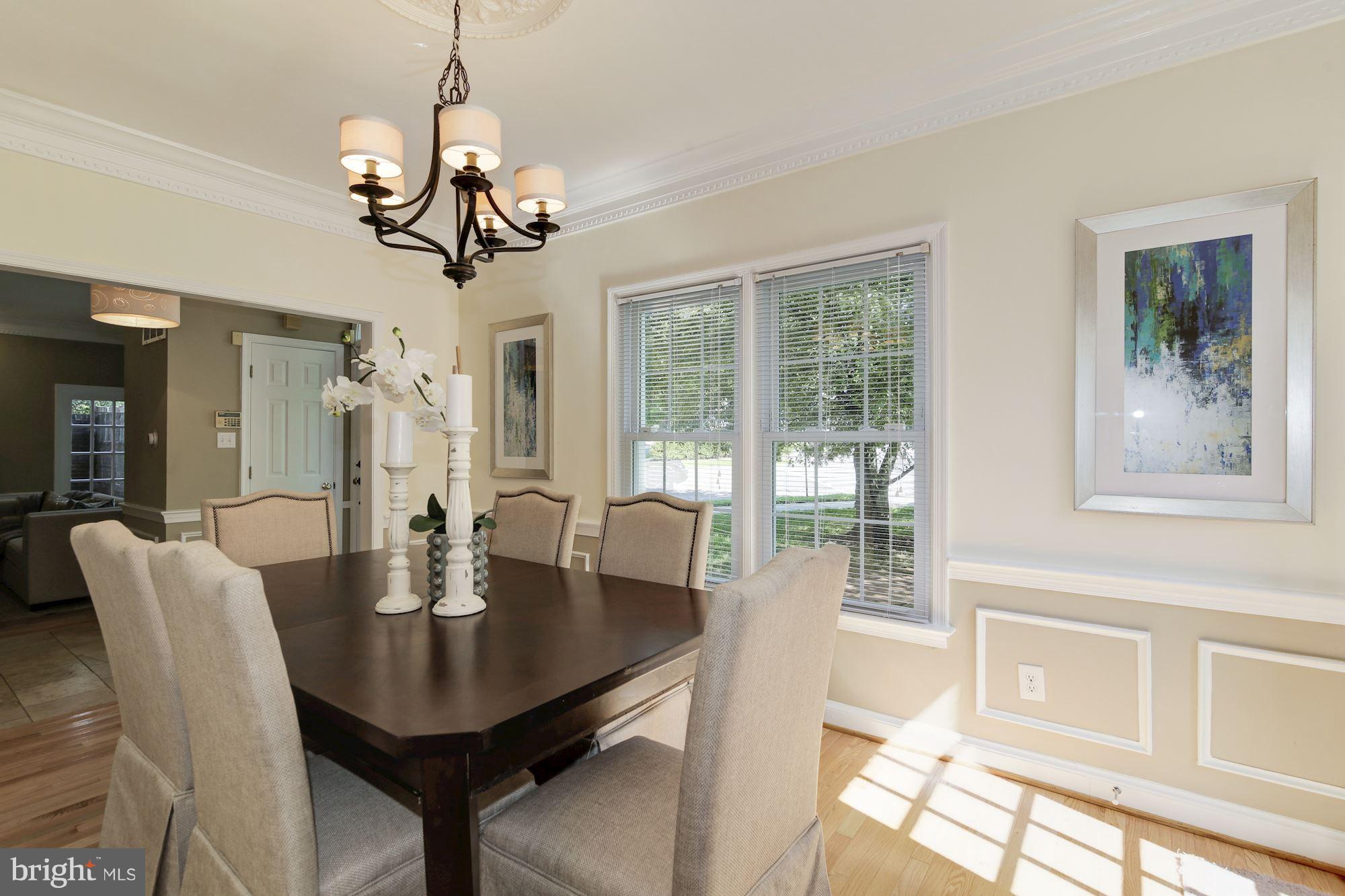 4200 River Road Northwest Washington, DC 20016 - Photo 8 of 30 a view of a dining room with furniture wooden floor chandelier