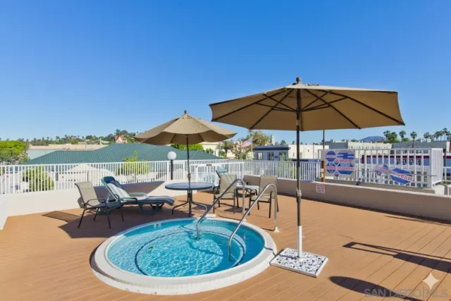 a view of a swimming pool with a patio
