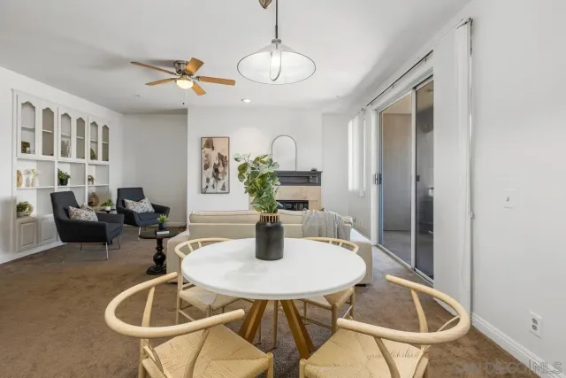 a kitchen with a table and chairs