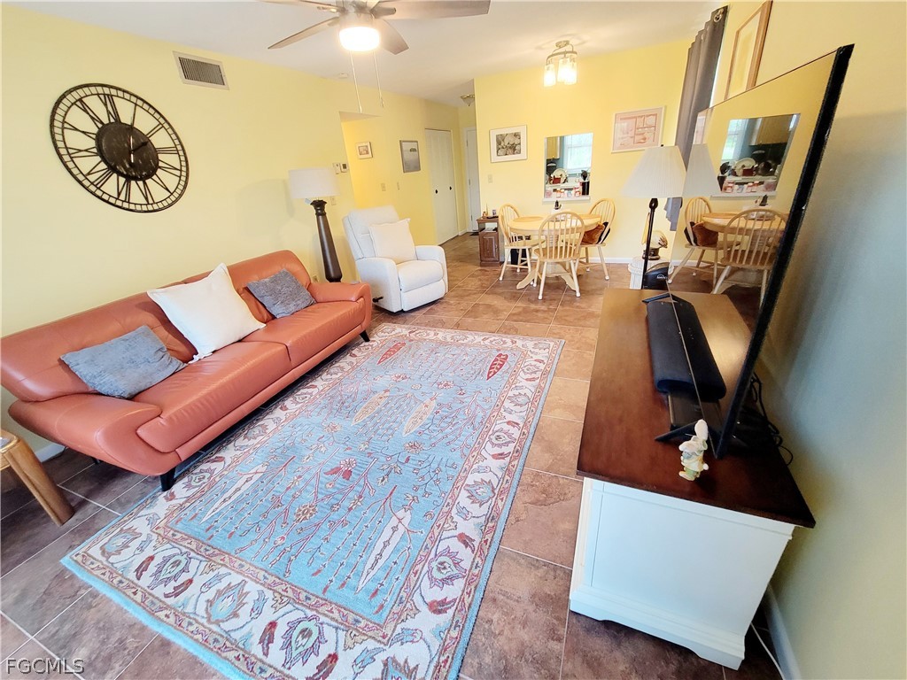 a living room with furniture and a table