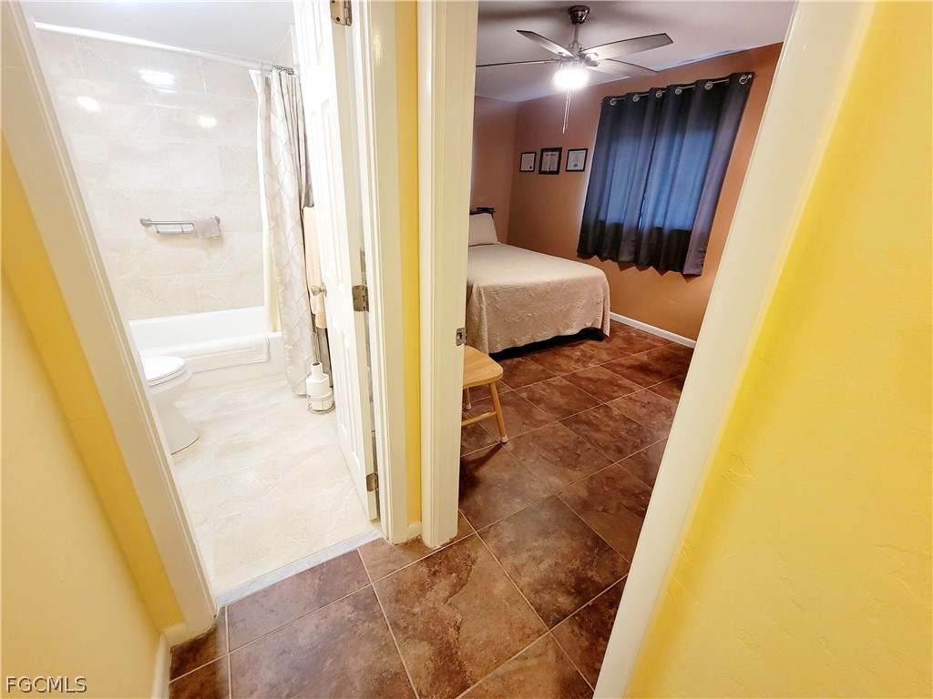 2206 East 6th Street Lehigh Acres, FL 33936 - Photo 17 of 30 a bathroom with a sink and a mirror