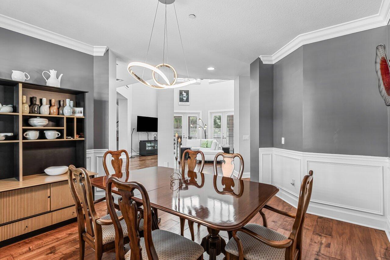1802 Southwest Trailside Path Stuart, FL 34997 - Photo 12 of 57 a view of a dining room with furniture