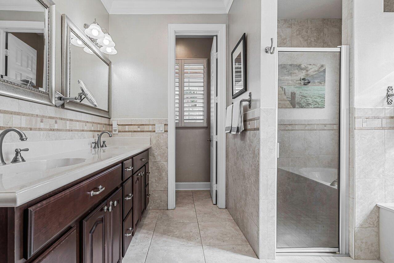 1802 Southwest Trailside Path Stuart, FL 34997 - Photo 15 of 57 a bathroom with a double vanity sink mirror and shower