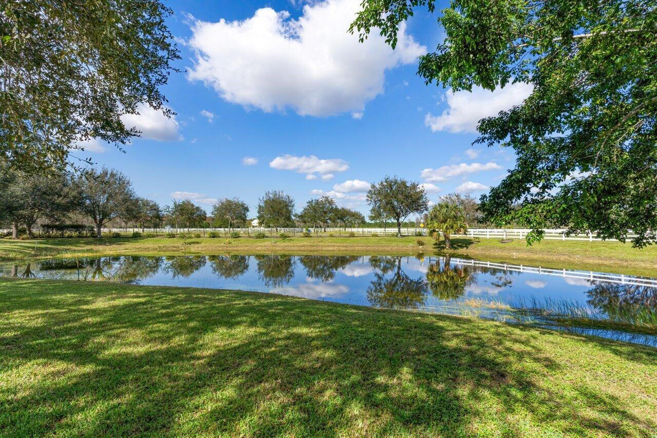 1802 Southwest Trailside Path Stuart, FL 34997 - Photo 41 of 57 a view of a lake with houses in the back