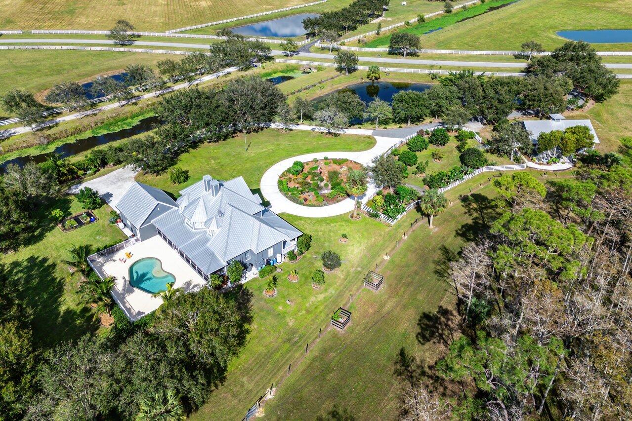 1802 Southwest Trailside Path Stuart, FL 34997 - Photo 49 of 57 an aerial view of residential house with outdoor space swimming pool and outdoor seating