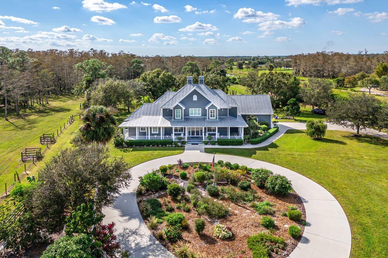 1802 Southwest Trailside Path Stuart, FL 34997 - Photo 56 of 57 a view of a house with a big yard and large trees