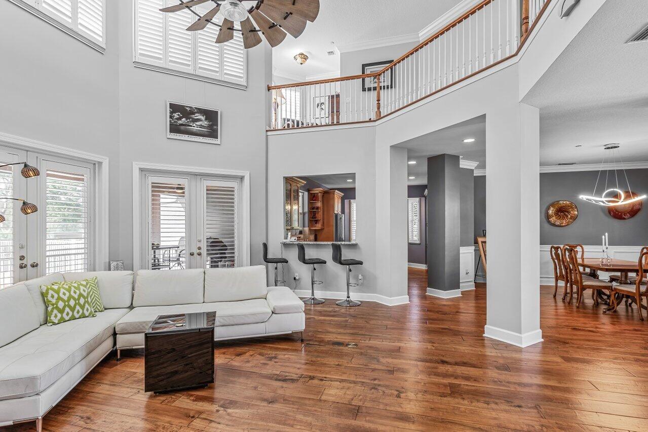 1802 Southwest Trailside Path Stuart, FL 34997 - Photo 7 of 57 a living room with furniture and wooden floor