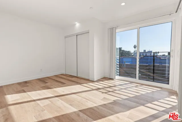 a view of a livingroom with wooden floor