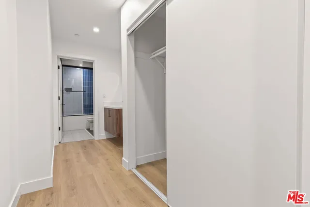 a view of a room with wooden floor and staircase