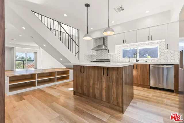 a view of kitchen with wooden floor and window