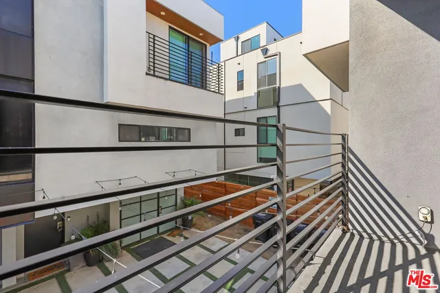 a view of balcony with wooden floor