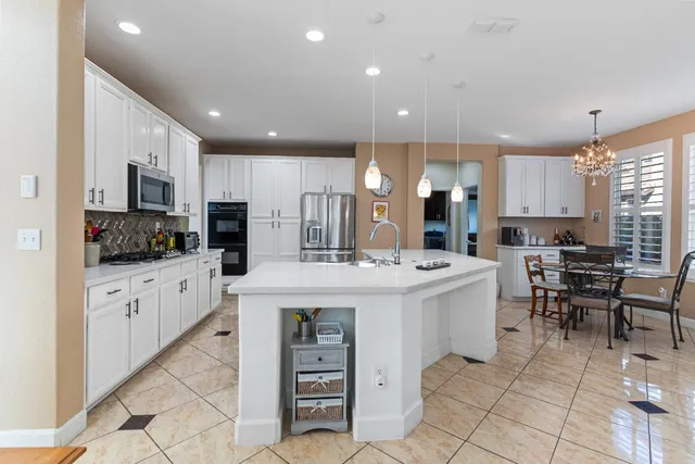 a living room with furniture large window and flat screen tv