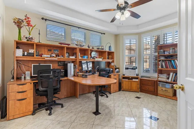 a bathroom with a granite countertop sink a toilet and a mirror