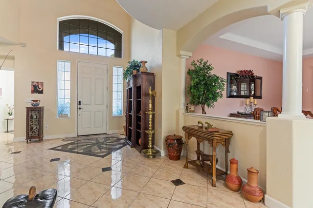 a view of a tables and chair and potted plant