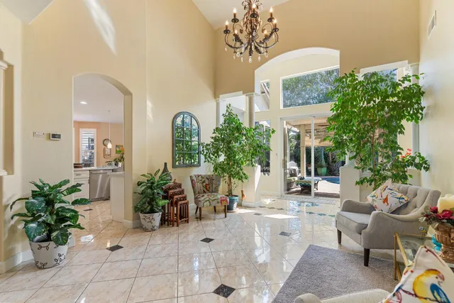 a view of a dining room with furniture and window