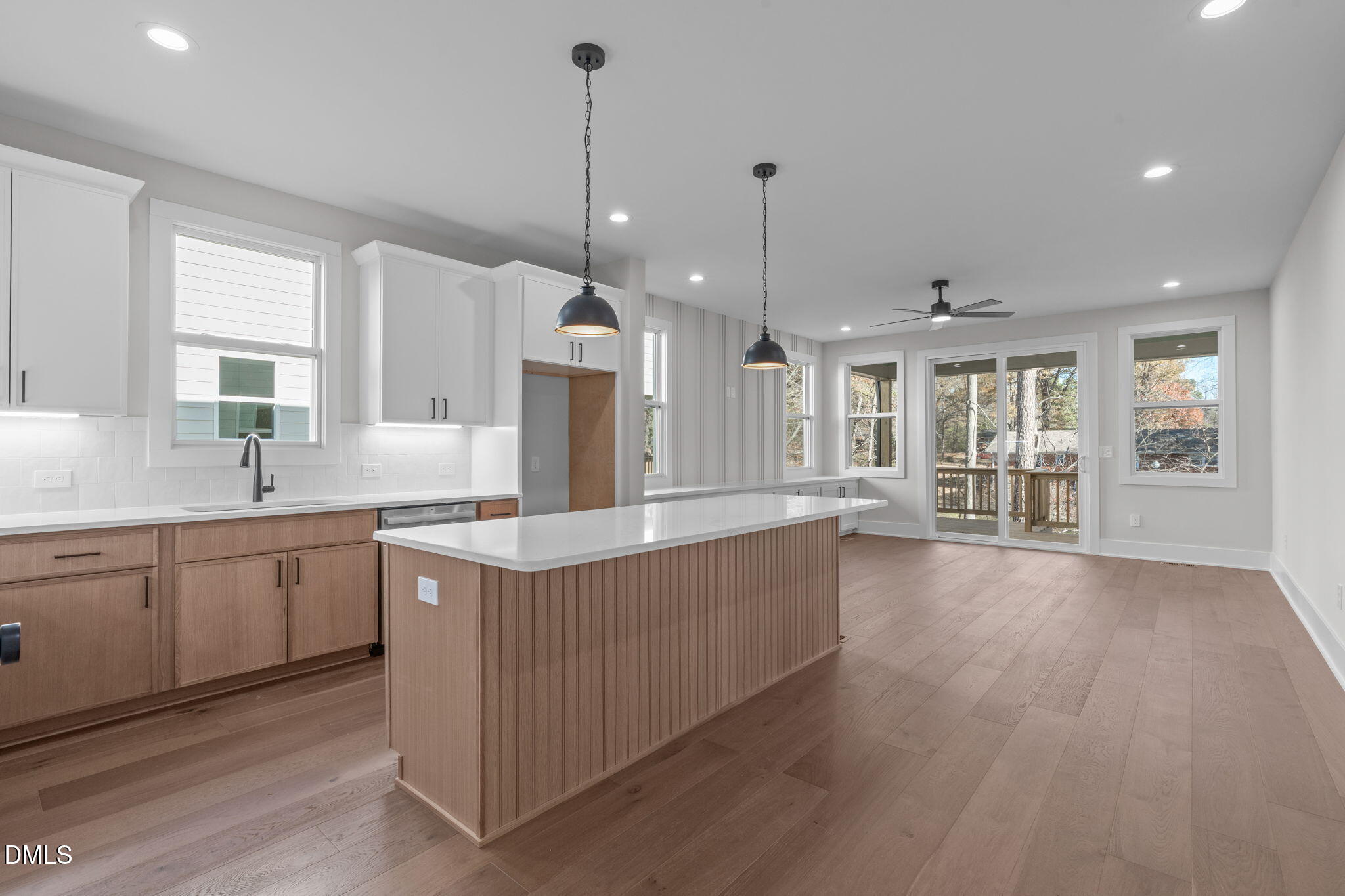 639 Conover Road, Unit A Durham, NC 27703 - Photo 15 of 49 a kitchen with stainless steel appliances granite countertop a sink a stove and a wooden floors