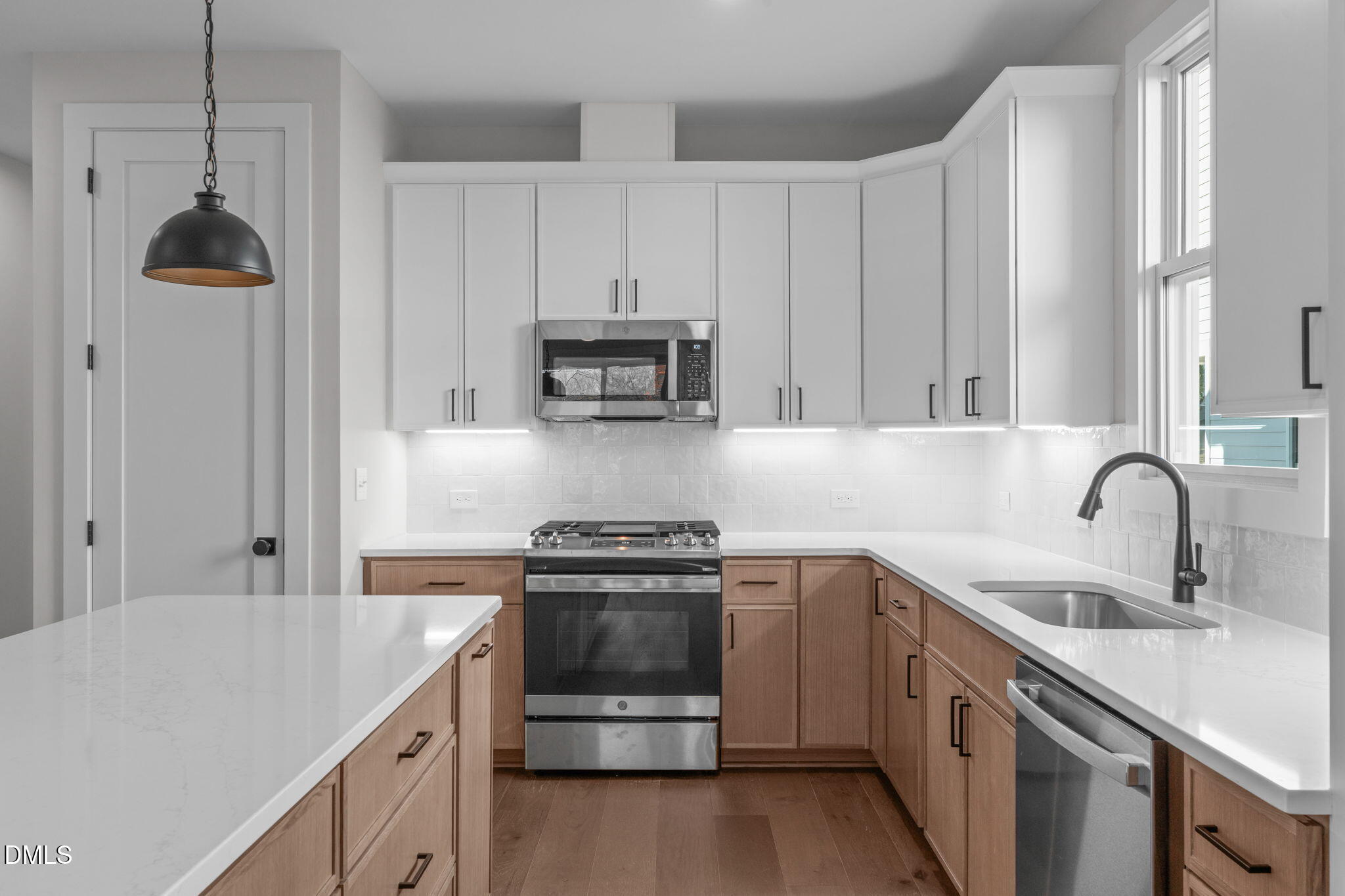 639 Conover Road, Unit A Durham, NC 27703 - Photo 18 of 49 a kitchen with appliances a sink and cabinets