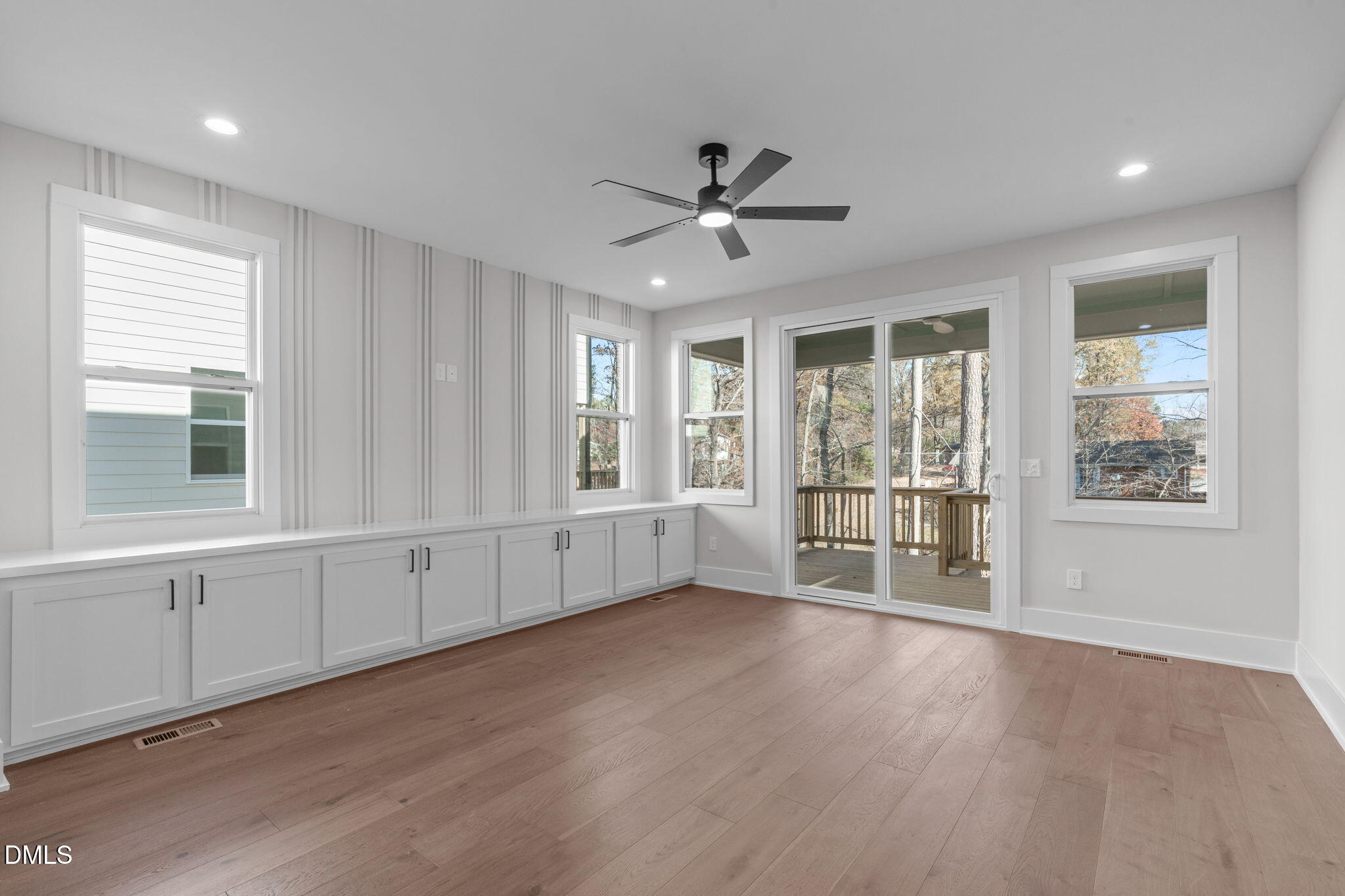 639 Conover Road, Unit A Durham, NC 27703 - Photo 21 of 49 a view of an empty room with a window and wooden floor