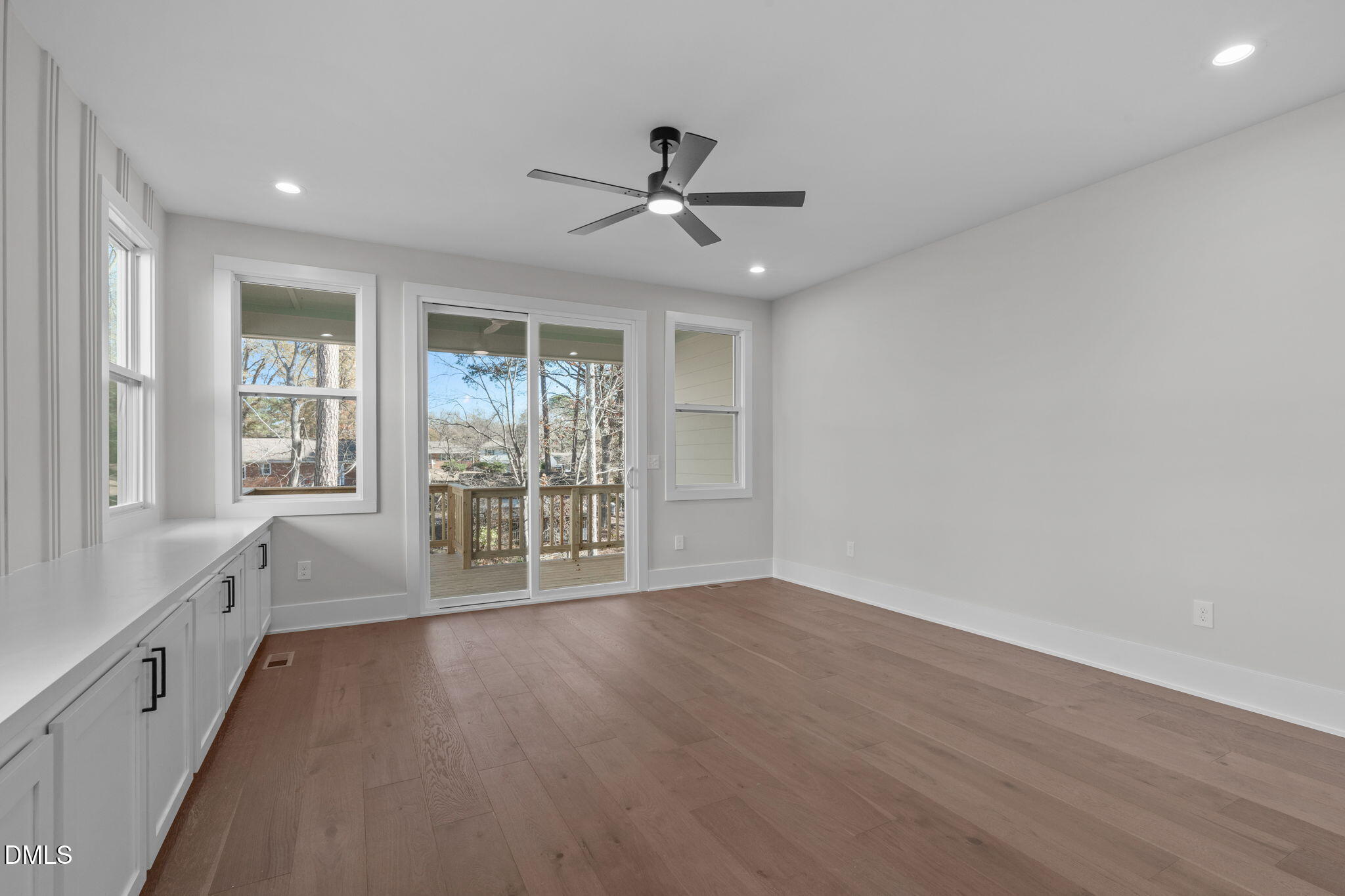 639 Conover Road, Unit A Durham, NC 27703 - Photo 22 of 49 an empty room with wooden floor and windows
