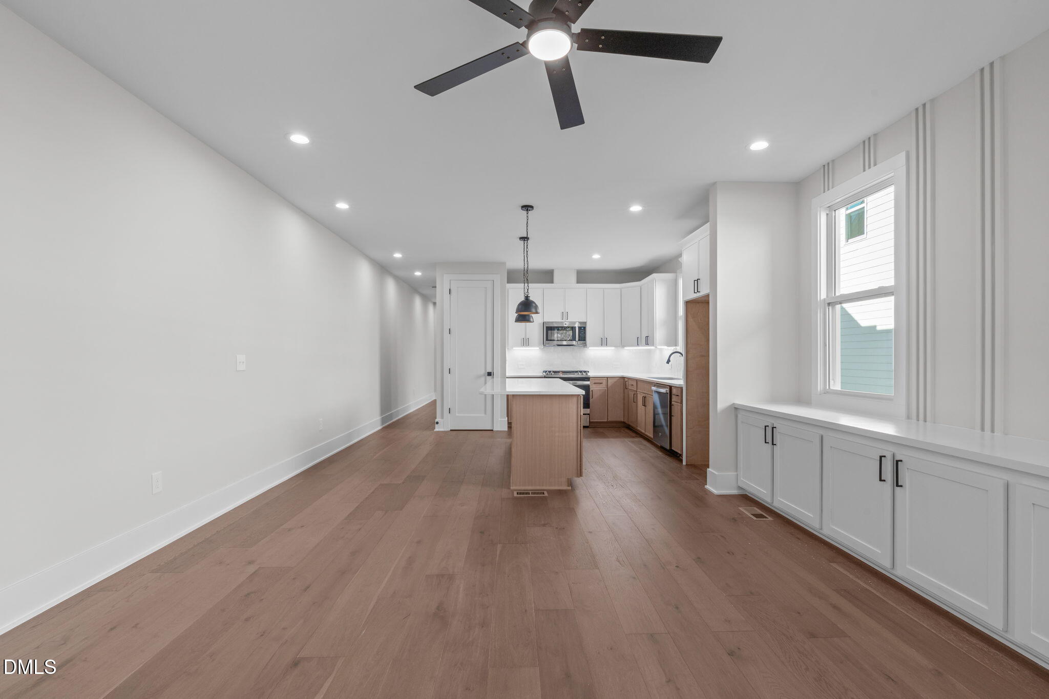 639 Conover Road, Unit A Durham, NC 27703 - Photo 24 of 49 a open kitchen with white cabinets and white appliances