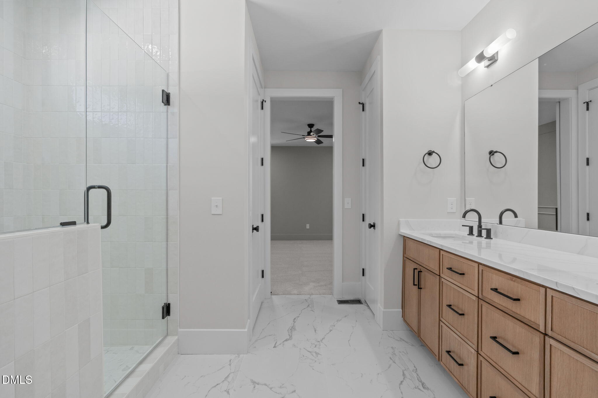 639 Conover Road, Unit A Durham, NC 27703 - Photo 31 of 49 a spacious bathroom with a granite countertop sink a mirror and shower