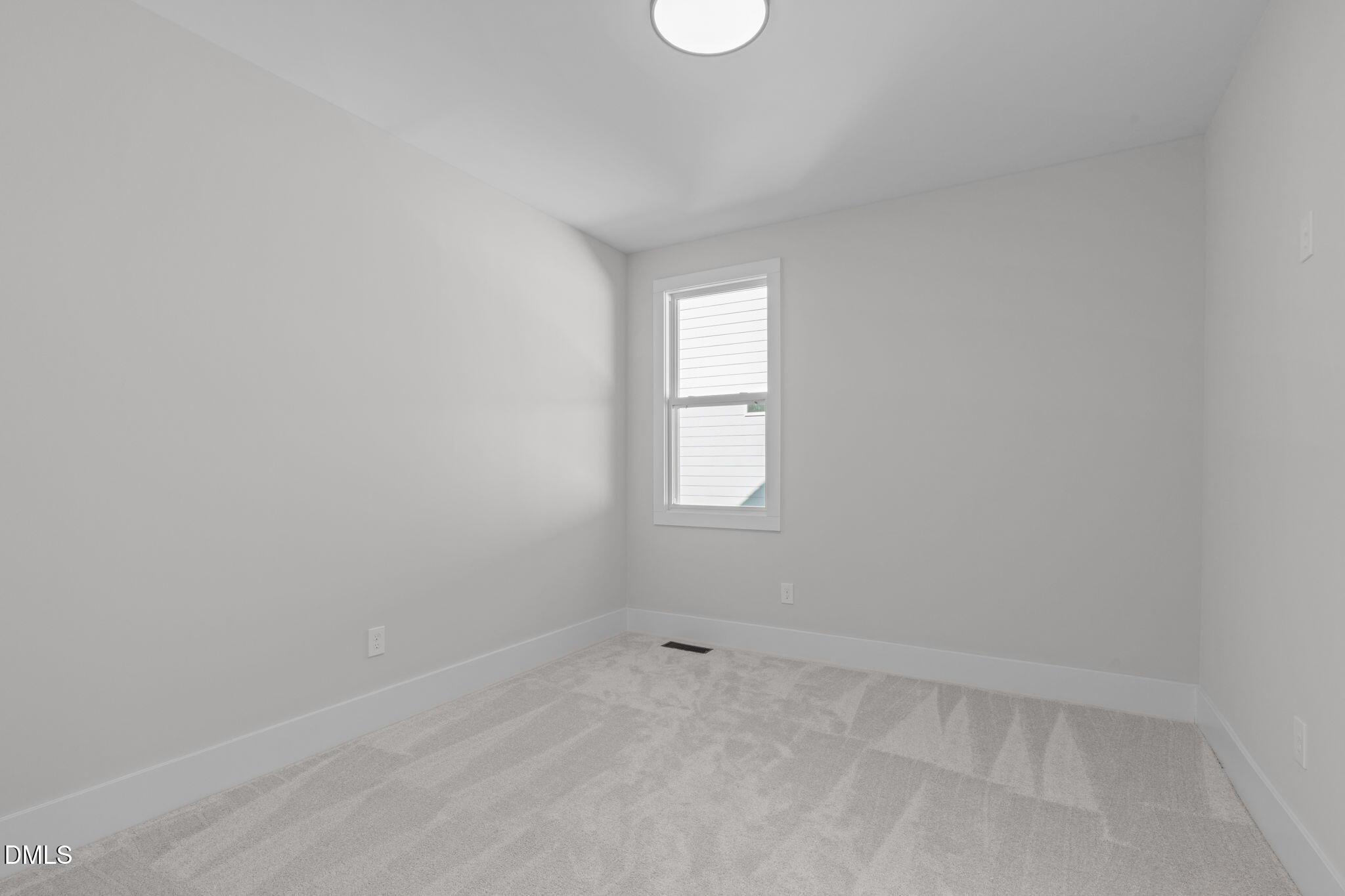 639 Conover Road, Unit A Durham, NC 27703 - Photo 34 of 49 an empty room with a window