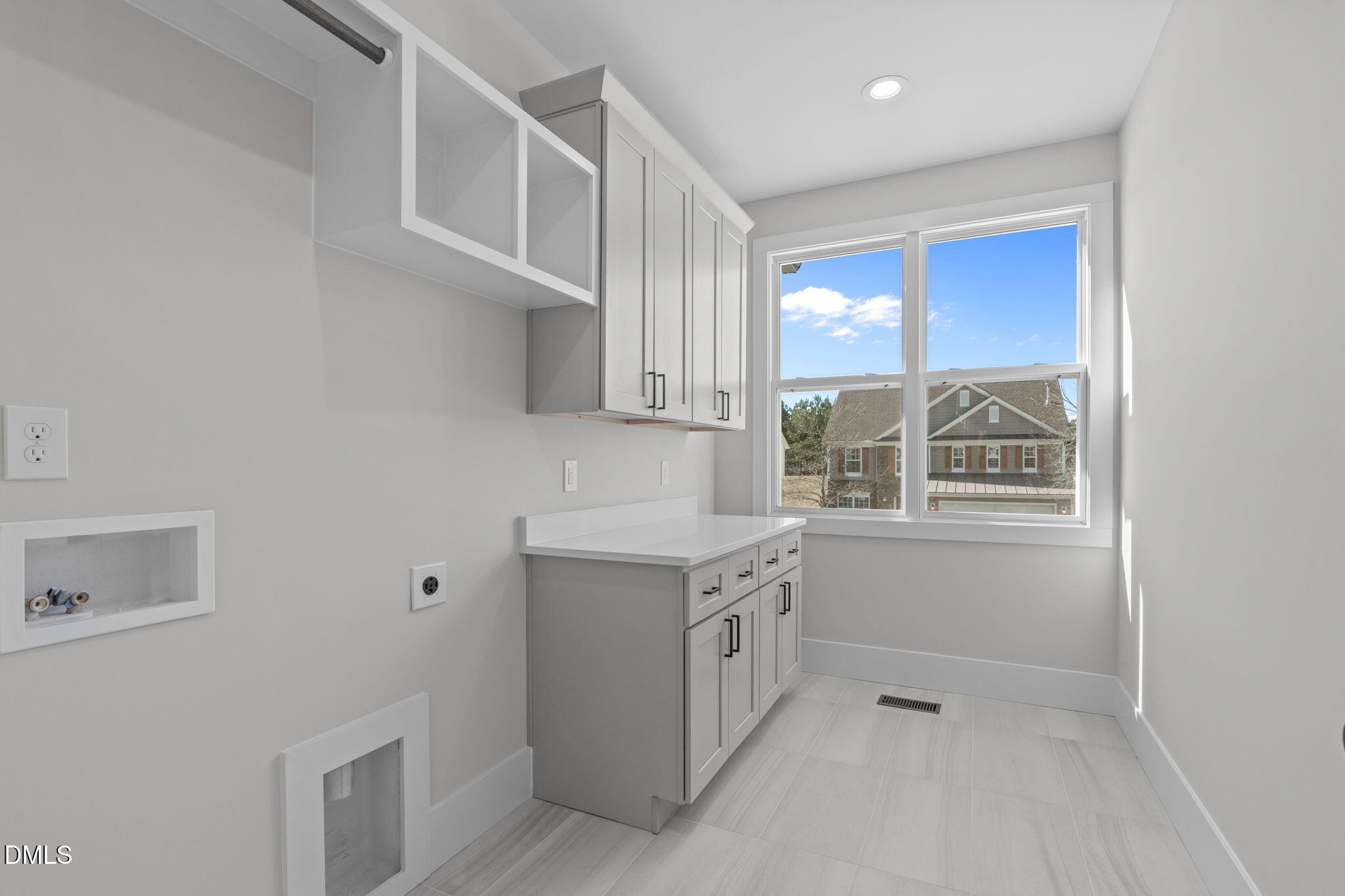 639 Conover Road, Unit A Durham, NC 27703 - Photo 39 of 49 a kitchen with a stove a sink and a window