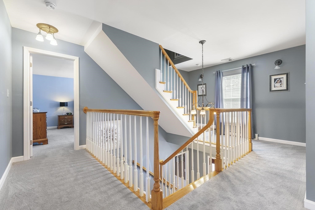 16 Windsor Street Everett, MA 02149 - Photo 14 of 40 a view of a hallway view with staircase