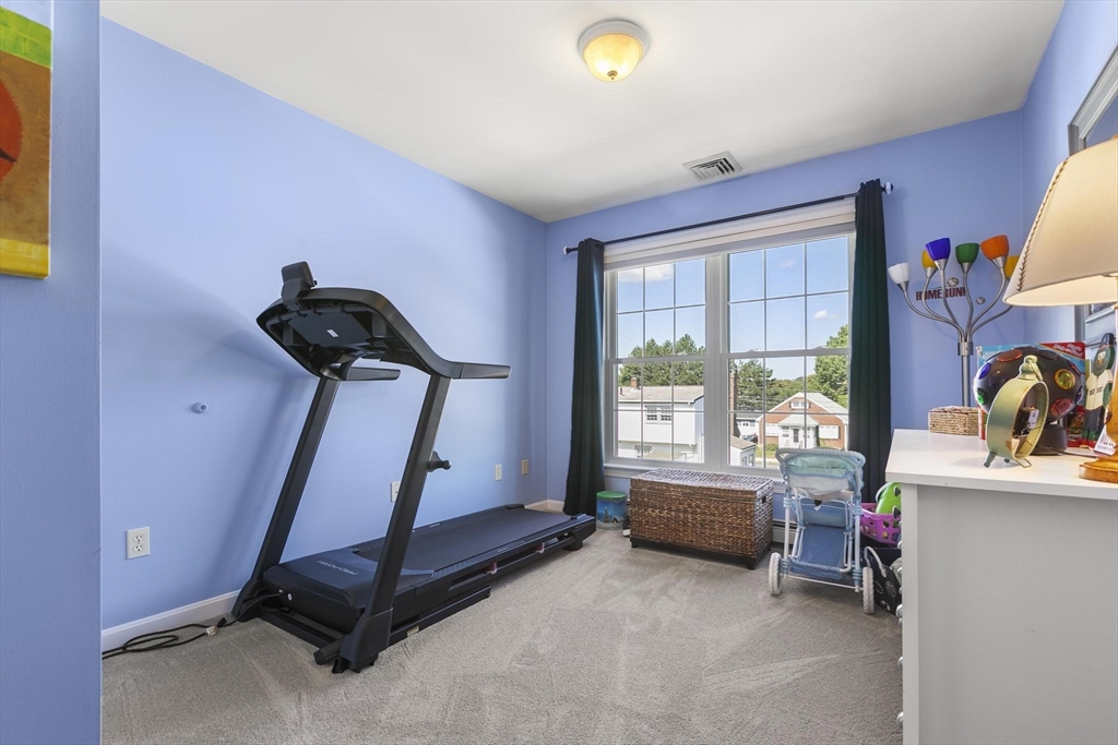 16 Windsor Street Everett, MA 02149 - Photo 18 of 40 a room with gym equipment and a window