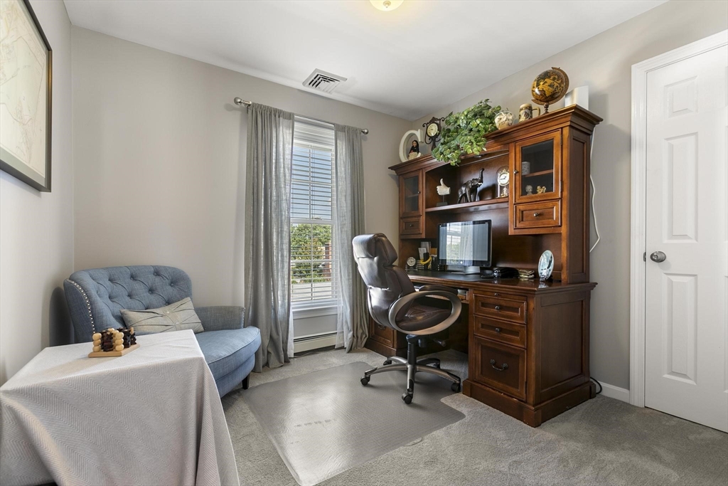 16 Windsor Street Everett, MA 02149 - Photo 21 of 40 a living room with furniture and a flat screen tv