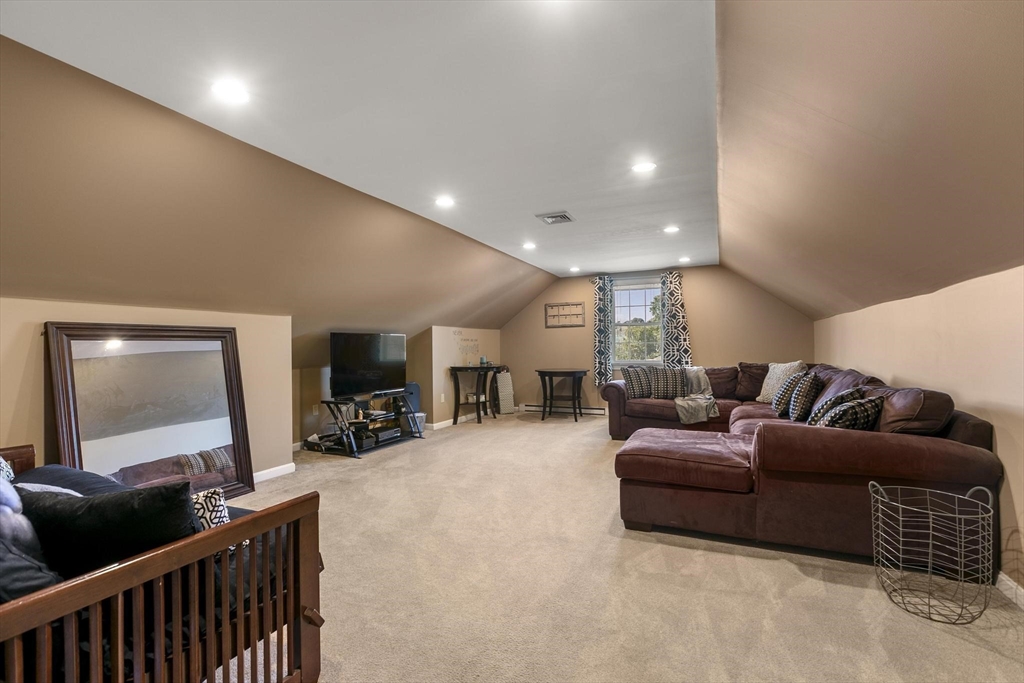 16 Windsor Street Everett, MA 02149 - Photo 23 of 40 a living room with furniture and a flat screen tv