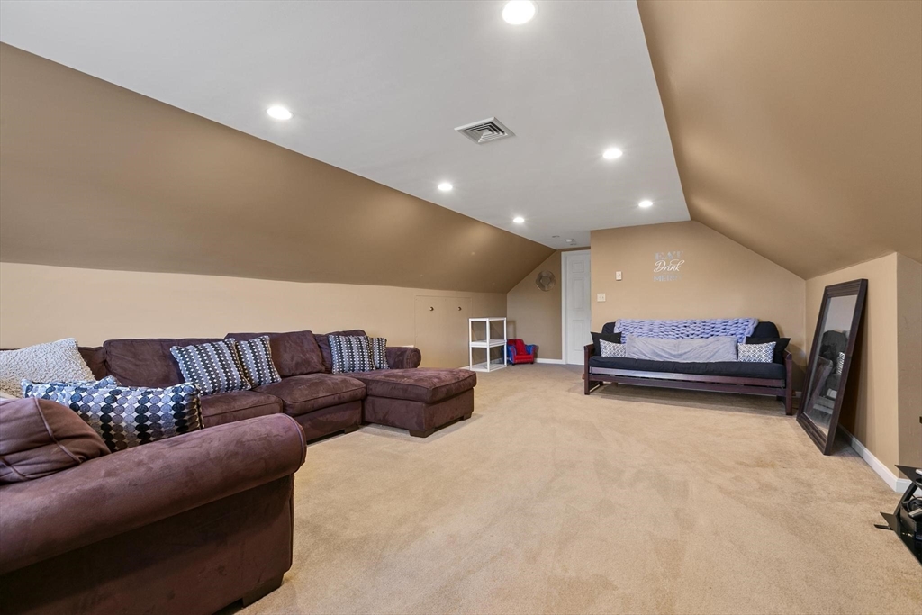 16 Windsor Street Everett, MA 02149 - Photo 24 of 40 a living room with furniture and a couch