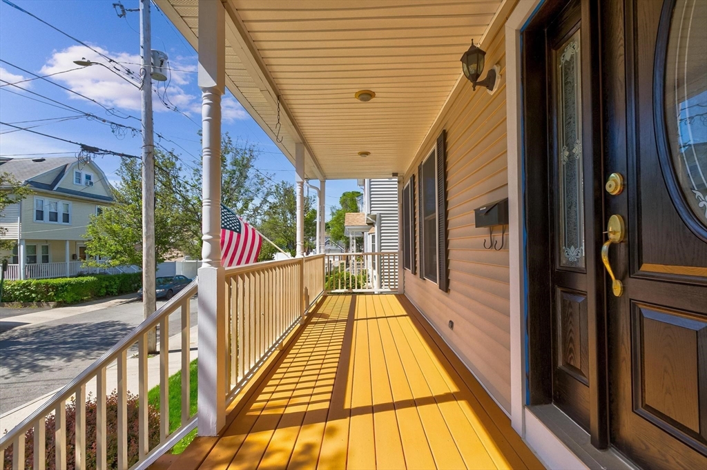 16 Windsor Street Everett, MA 02149 - Photo 31 of 40 a view of balcony with wooden floor
