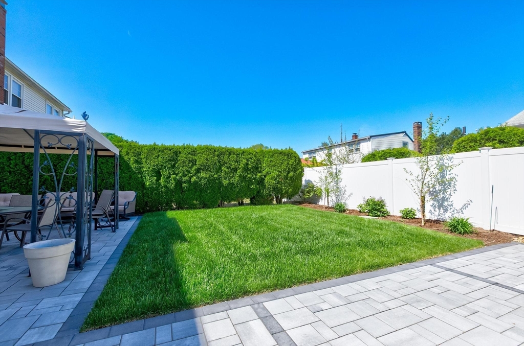 16 Windsor Street Everett, MA 02149 - Photo 33 of 40 a view of a backyard with sitting area