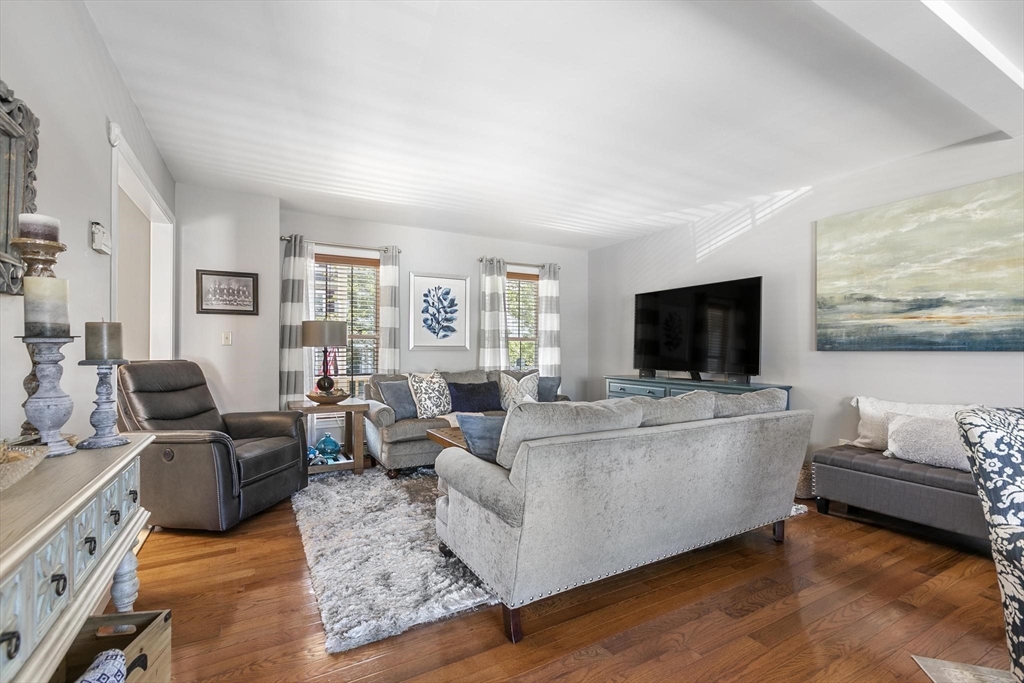 16 Windsor Street Everett, MA 02149 - Photo 5 of 40 a living room with furniture and a flat screen tv