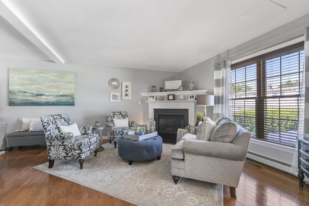 16 Windsor Street Everett, MA 02149 - Photo 7 of 40 a living room with furniture and a fireplace