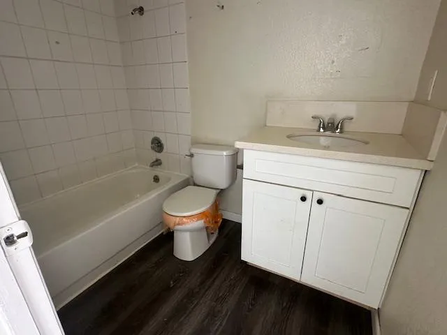 a bathroom with a sink a toilet and bathtub