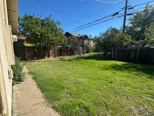 a view of a backyard with a small cabin