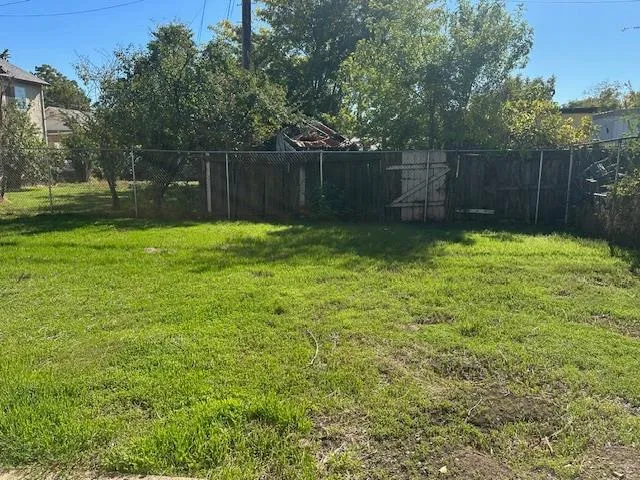 a backyard of a house with lots of green space