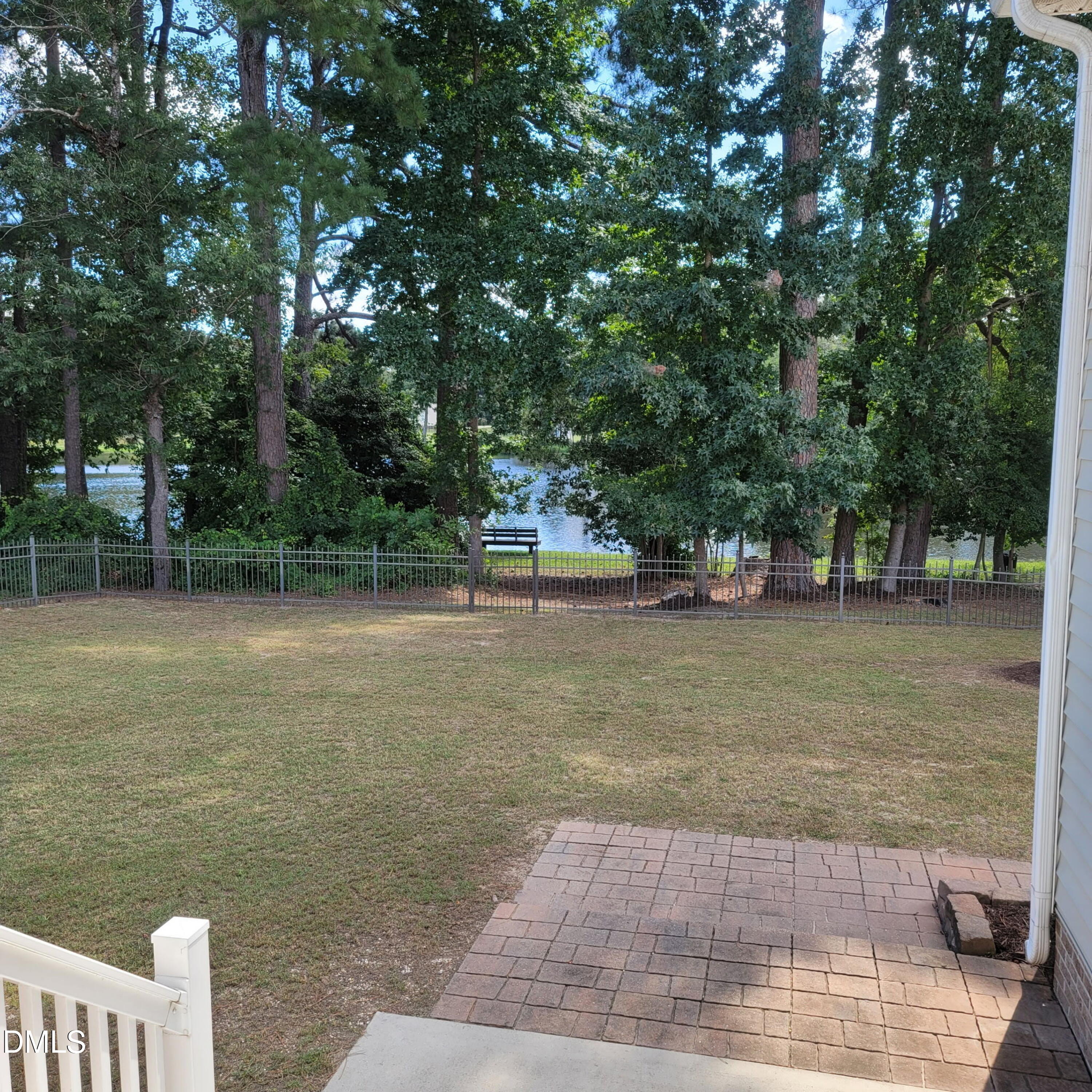 136 Kenneth Lane Willow Spring, NC 27592 - Photo 60 of 94 Pond view Fire pit in rear right side of yard
