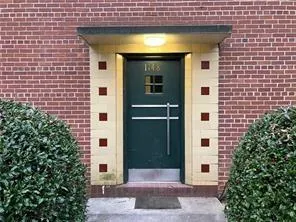 a view of a wooden door of the house