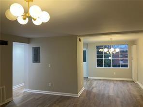1148 Briarcliff Road Northeast, Unit 1 Atlanta, GA 30306 - Photo 11 of 33 an empty room with wooden floor and windows