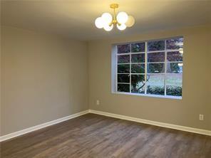 1148 Briarcliff Road Northeast, Unit 1 Atlanta, GA 30306 - Photo 18 of 33 a view of empty room with wooden floor and fan