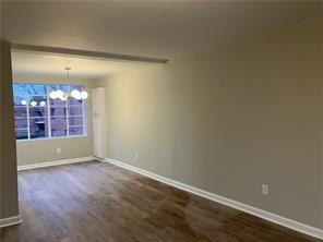 1148 Briarcliff Road Northeast, Unit 1 Atlanta, GA 30306 - Photo 19 of 33 wooden floor and window in an empty room