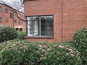 1148 Briarcliff Road Northeast, Unit 1 Atlanta, GA 30306 - Photo 2 of 33 a view of a building with a garden