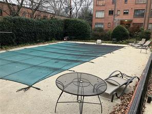 1148 Briarcliff Road Northeast, Unit 1 Atlanta, GA 30306 - Photo 30 of 33 a view of a swimming pool with a lounge chair