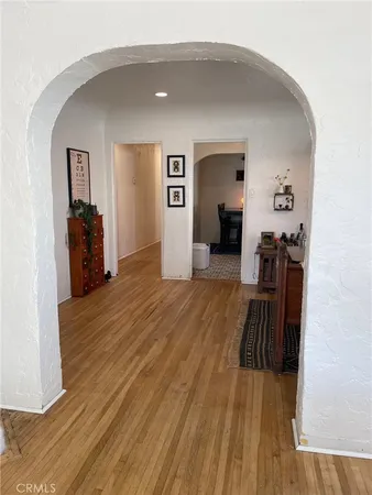 a view of a living room with wooden floor